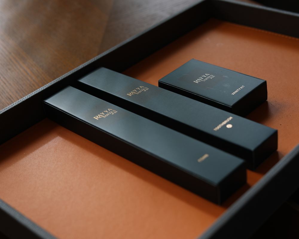 Rayya Suites signature bathroom amenities in a leather tray
